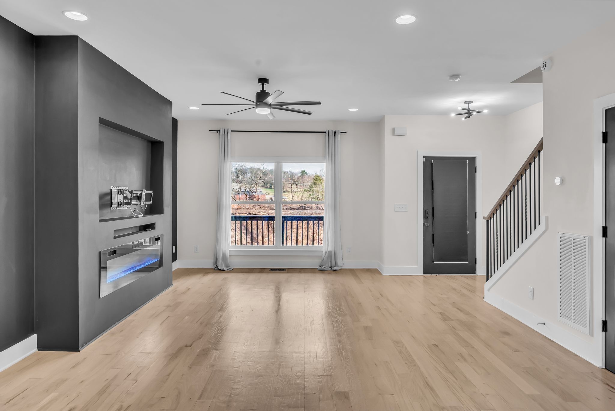 425 Toney Road, Unit B Nashville, TN 37207 - Photo 3 of 14 a view of an empty room with a window and wooden floor