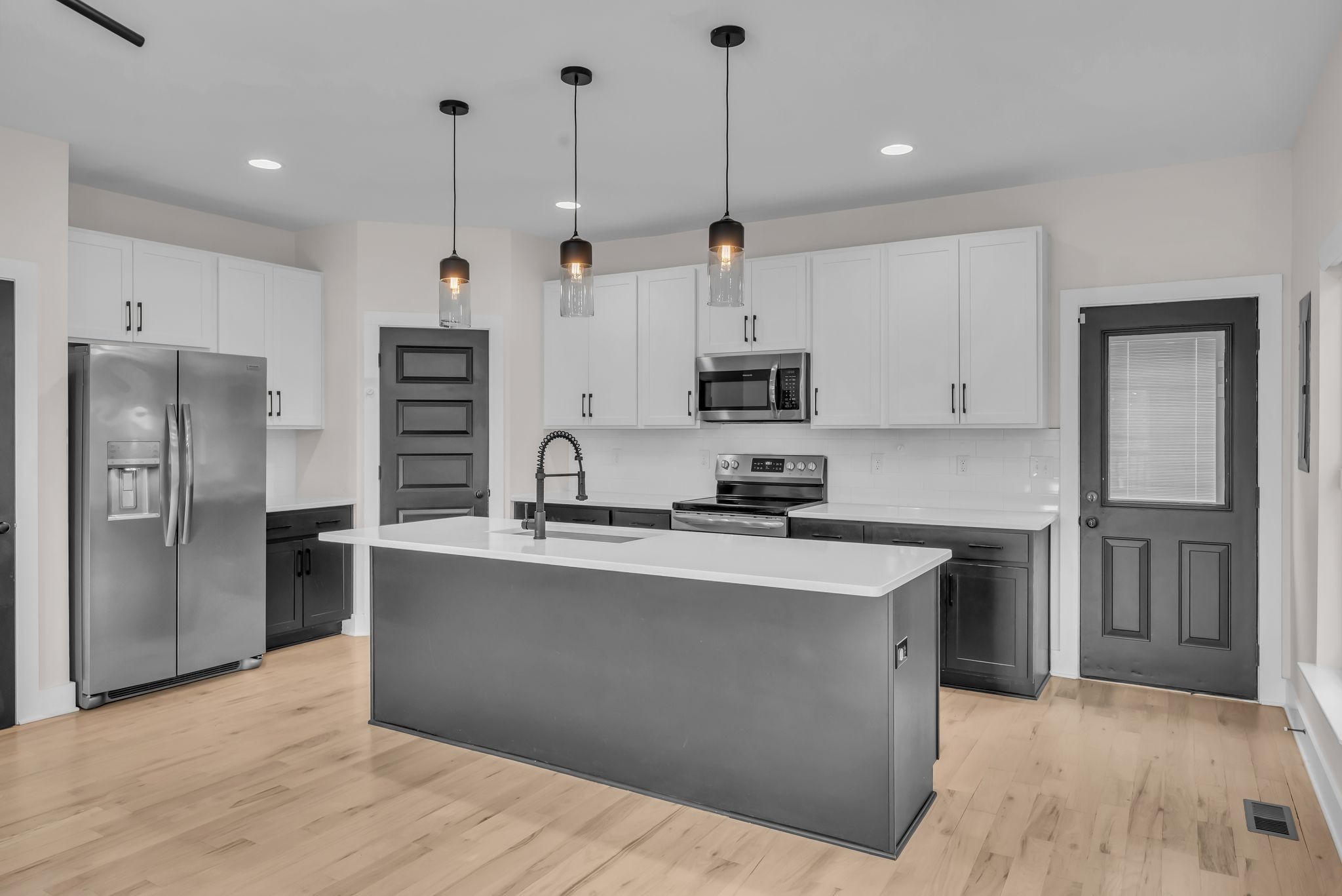 425 Toney Road, Unit B Nashville, TN 37207 - Photo 5 of 14 a kitchen with stainless steel appliances granite countertop a sink a stove and a refrigerator
