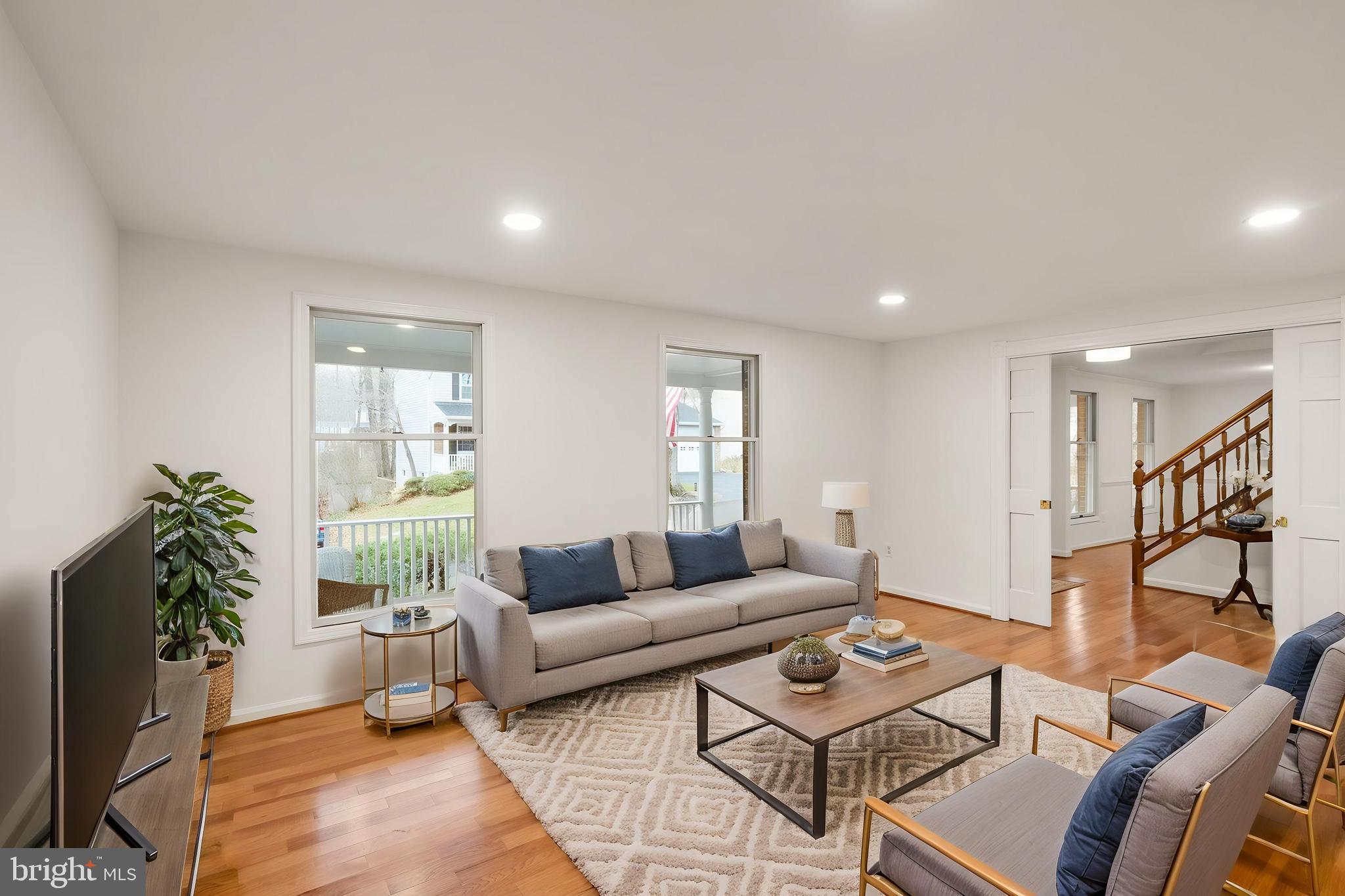 8461 Rushing Creek Court Springfield, VA 22153 - Photo 16 of 96 formal living room with doors. virtually staged