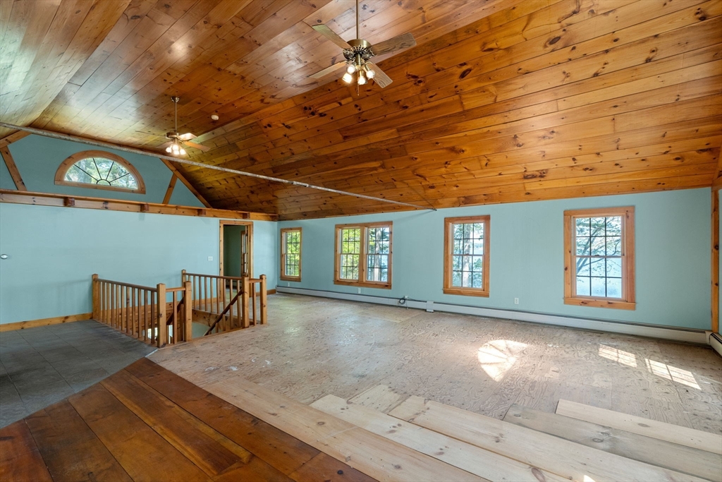 362 Snows Pond Road Rochester, MA 02770 - Photo 19 of 41 a view of an empty room with window and chandelier