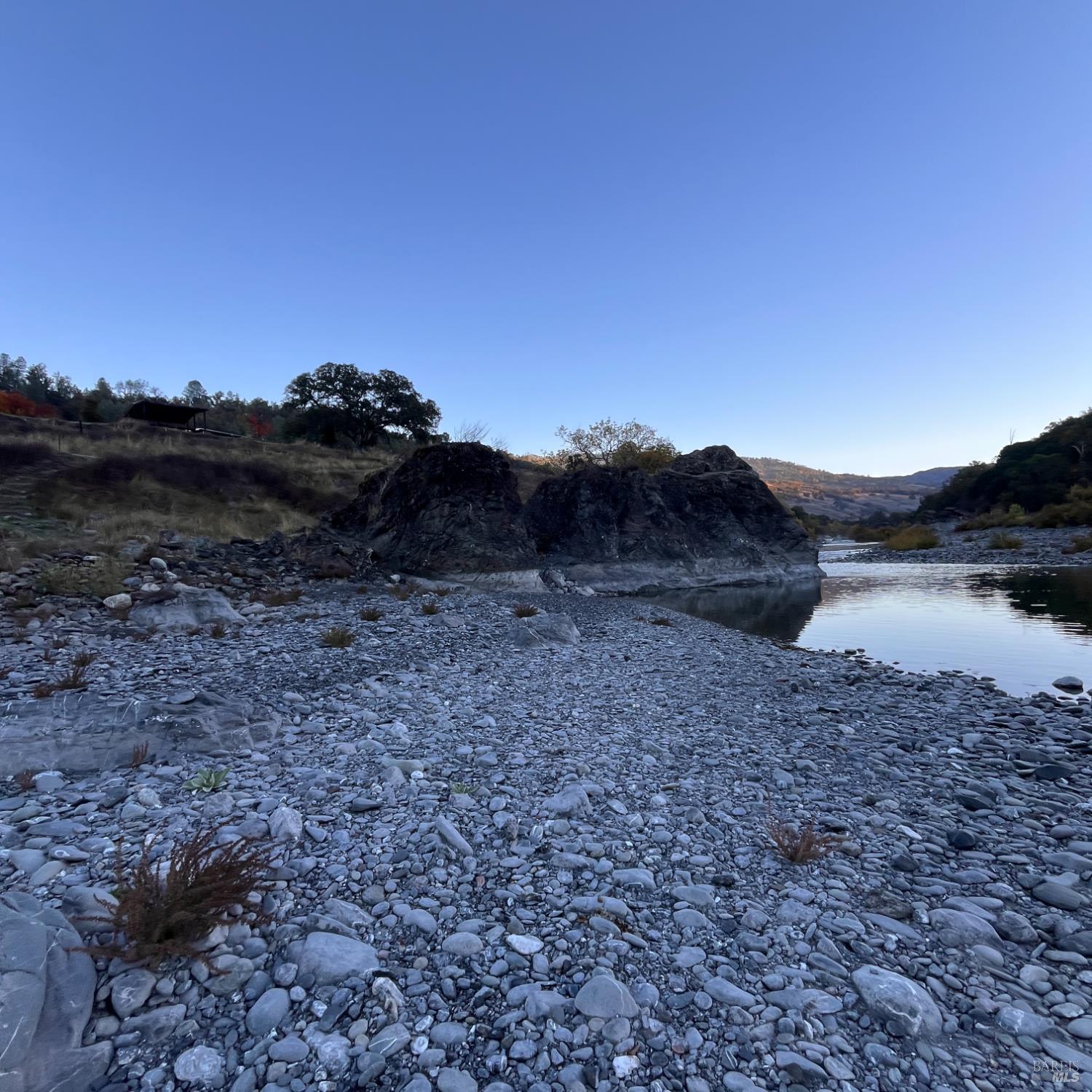 31975 Mendocino Pass Road Covelo, CA 95428 - Photo 4 of 23 a view of a dry yard with mountains in the background
