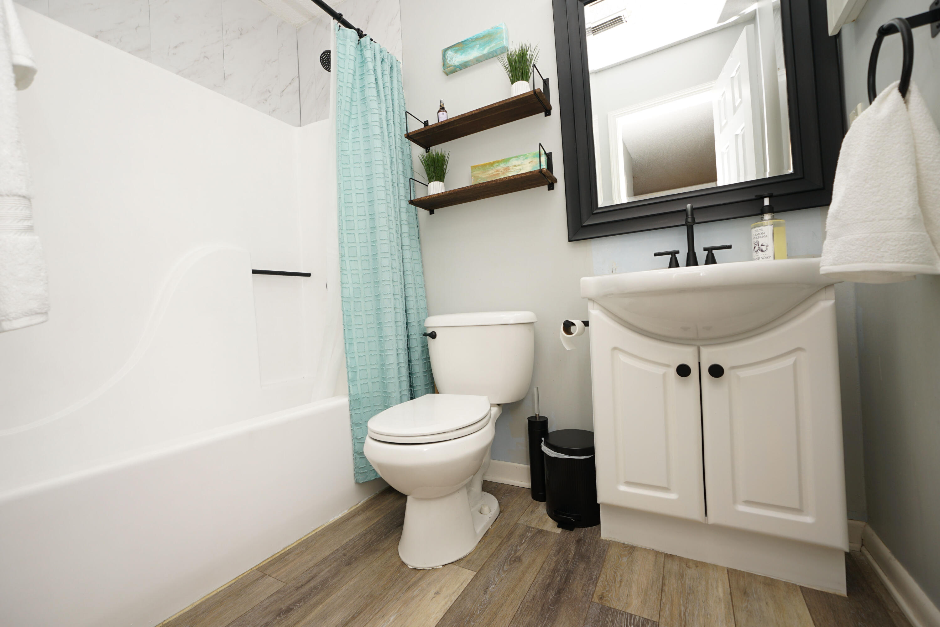55 Bay Drive, Unit 2202 Niceville, FL 32578 - Photo 22 of 29 a bathroom with a toilet sink and mirror