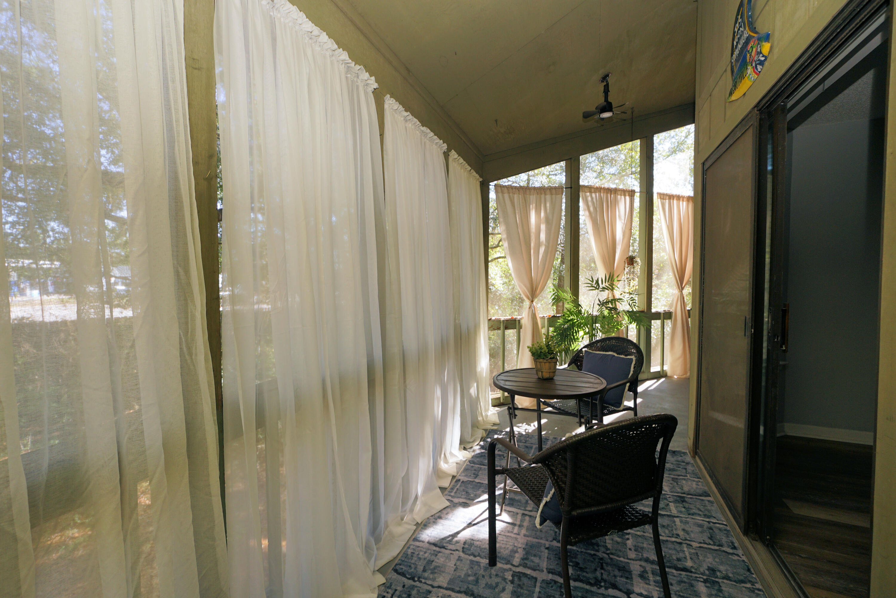 55 Bay Drive, Unit 2202 Niceville, FL 32578 - Photo 27 of 29 a living room with furniture and a window