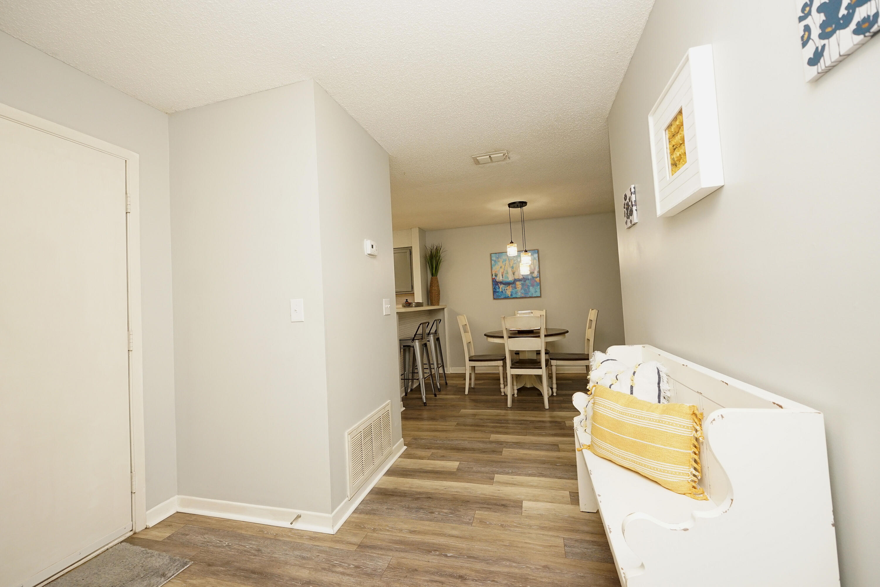 55 Bay Drive, Unit 2202 Niceville, FL 32578 - Photo 4 of 29 a living room with furniture and a table