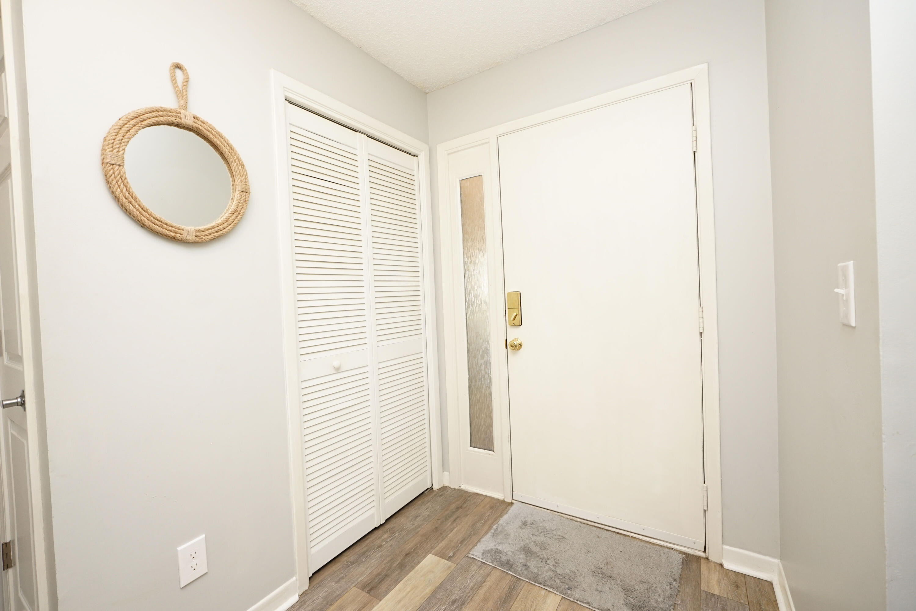 55 Bay Drive, Unit 2202 Niceville, FL 32578 - Photo 6 of 29 a view of a bathroom with a sink and a mirror