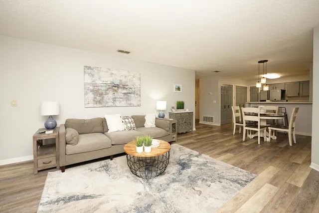 a living room with furniture and a table