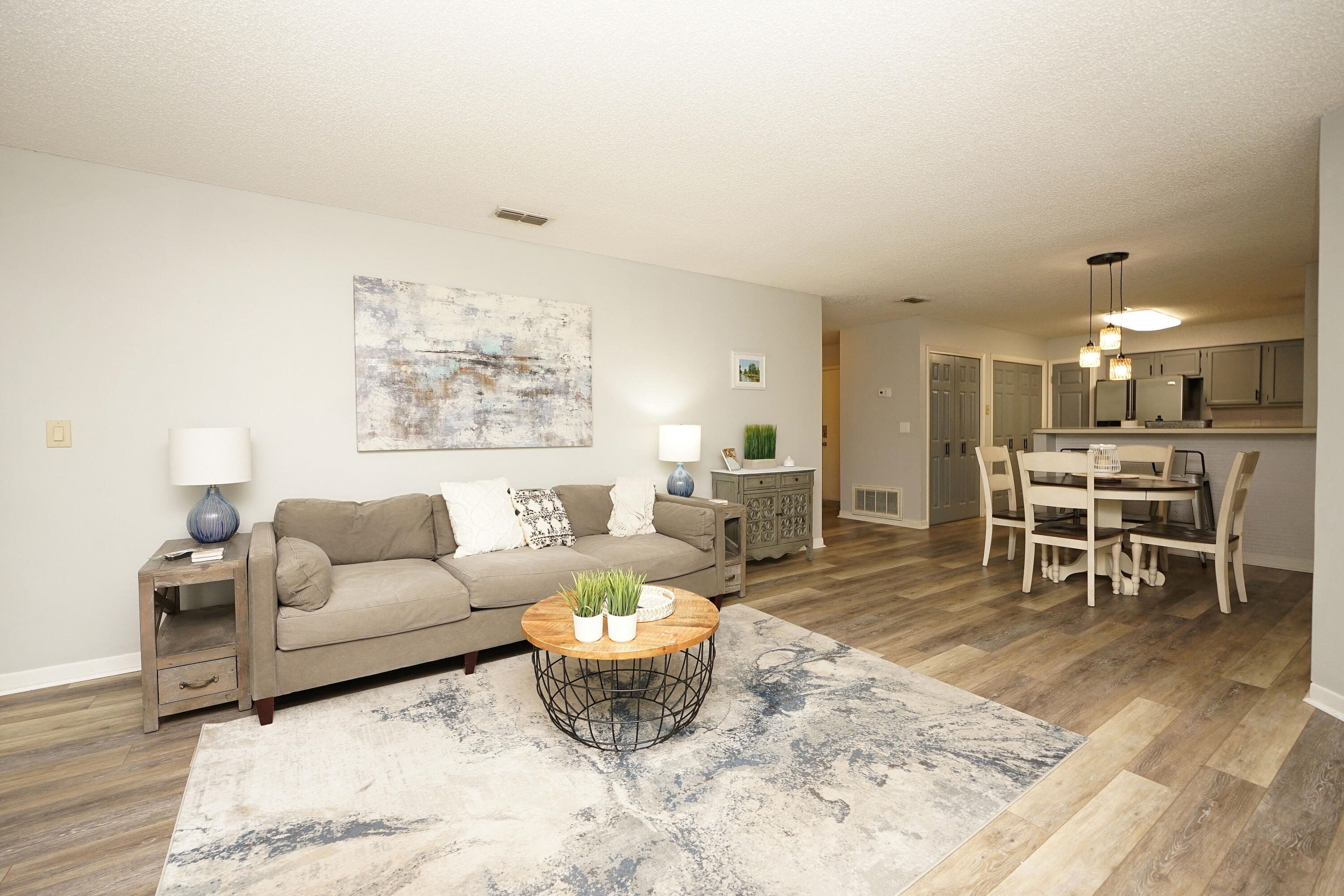 55 Bay Drive, Unit 2202 Niceville, FL 32578 - Photo 7 of 29 a living room with furniture and a table