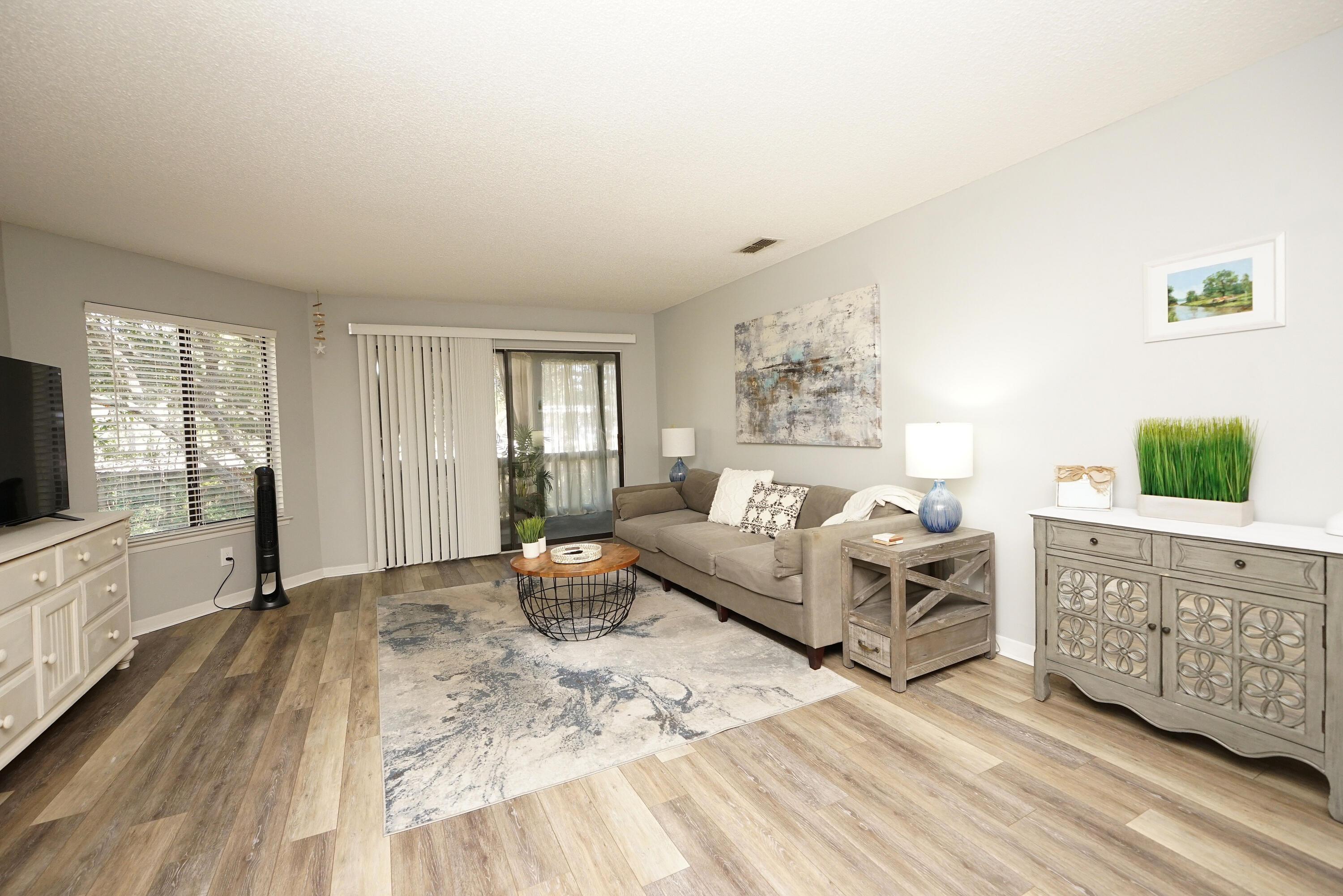 55 Bay Drive, Unit 2202 Niceville, FL 32578 - Photo 9 of 29 a living room with furniture and a flat screen tv