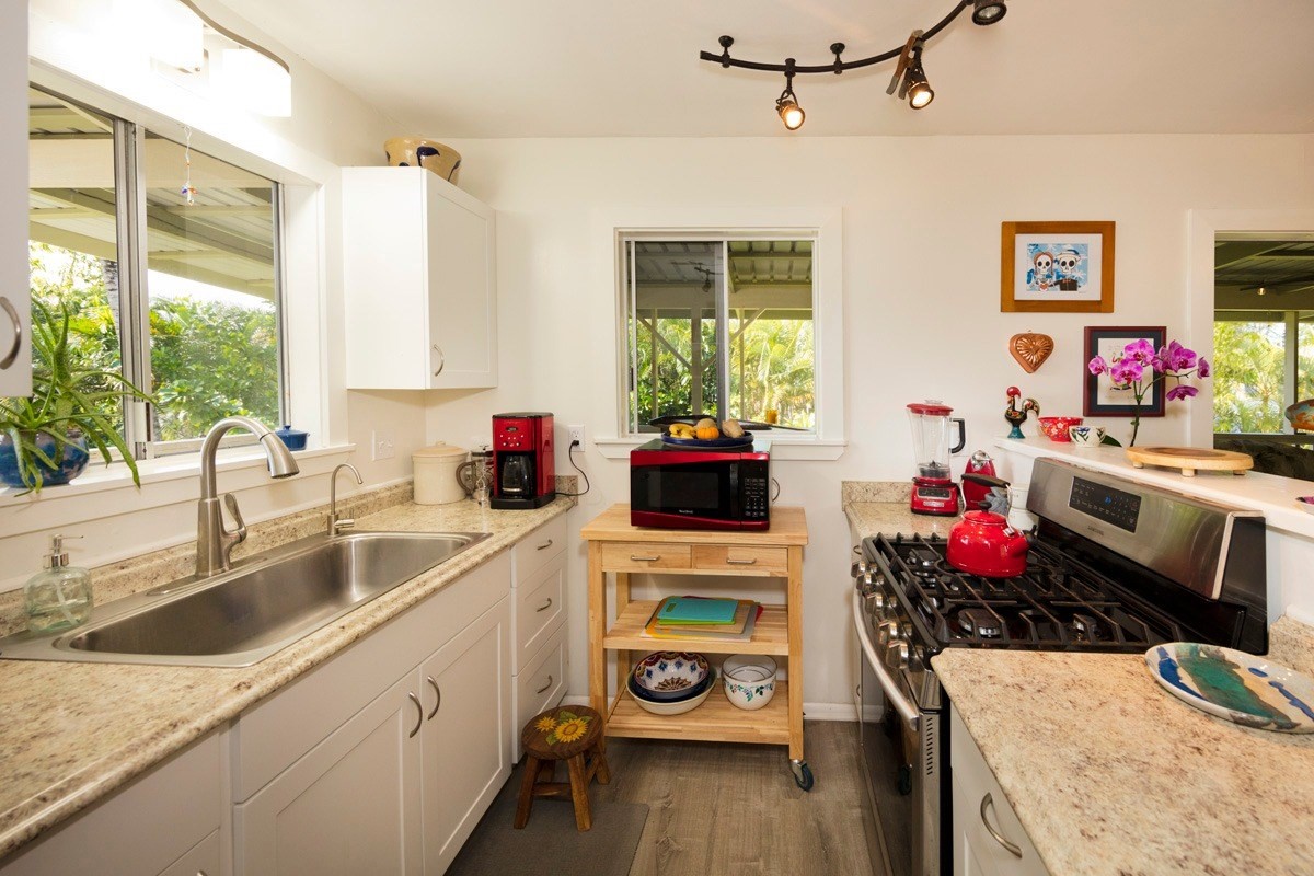 15-1565 Beach Road Keaau, HI 96749 - Photo 12 of 27 a kitchen with a sink stove and microwave