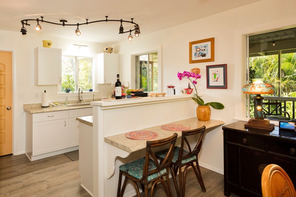 15-1565 Beach Road Keaau, HI 96749 - Photo 13 of 27 a view of a dining room and a table and chairs