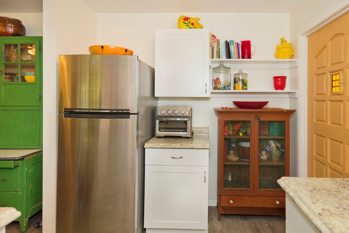 15-1565 Beach Road Keaau, HI 96749 - Photo 14 of 27 a kitchen with stainless steel appliances a refrigerator and a cabinets