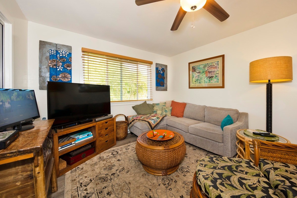 15-1565 Beach Road Keaau, HI 96749 - Photo 17 of 27 a living room with furniture and a flat screen tv