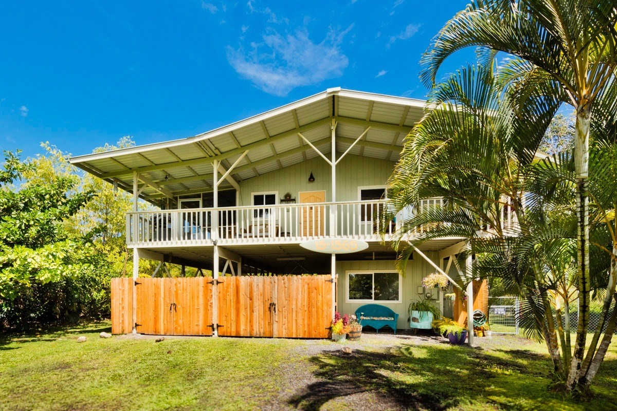 15-1565 Beach Road Keaau, HI 96749 - Photo 2 of 27 a front view of a house with a yard