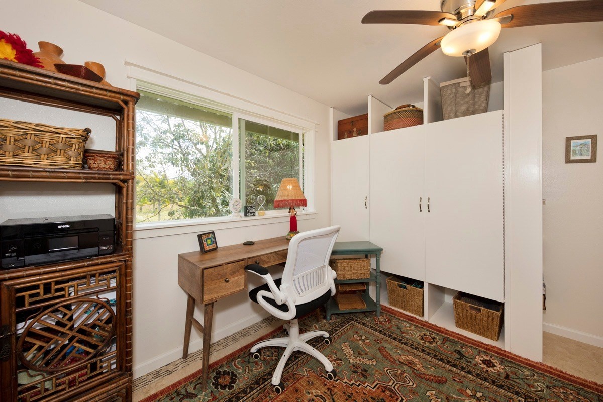 15-1565 Beach Road Keaau, HI 96749 - Photo 21 of 27 a view of a workspace with furniture and a window