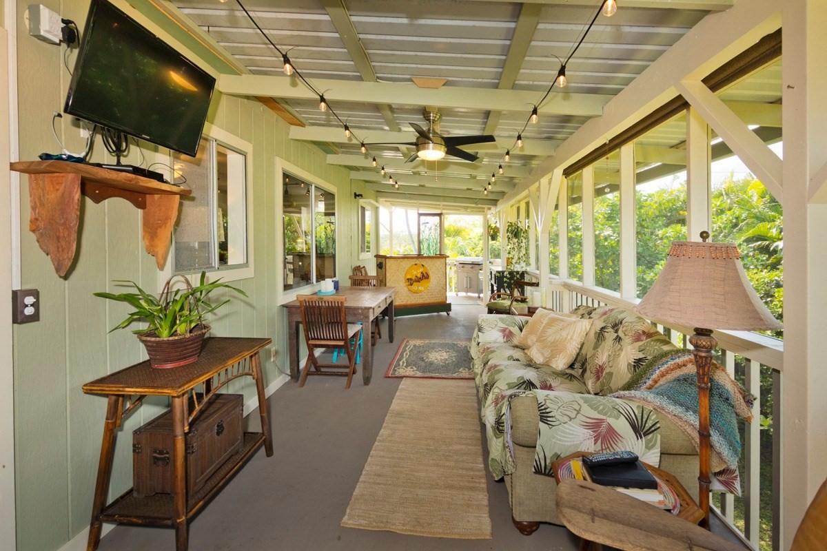 15-1565 Beach Road Keaau, HI 96749 - Photo 22 of 27 a living room with furniture and a flat screen tv