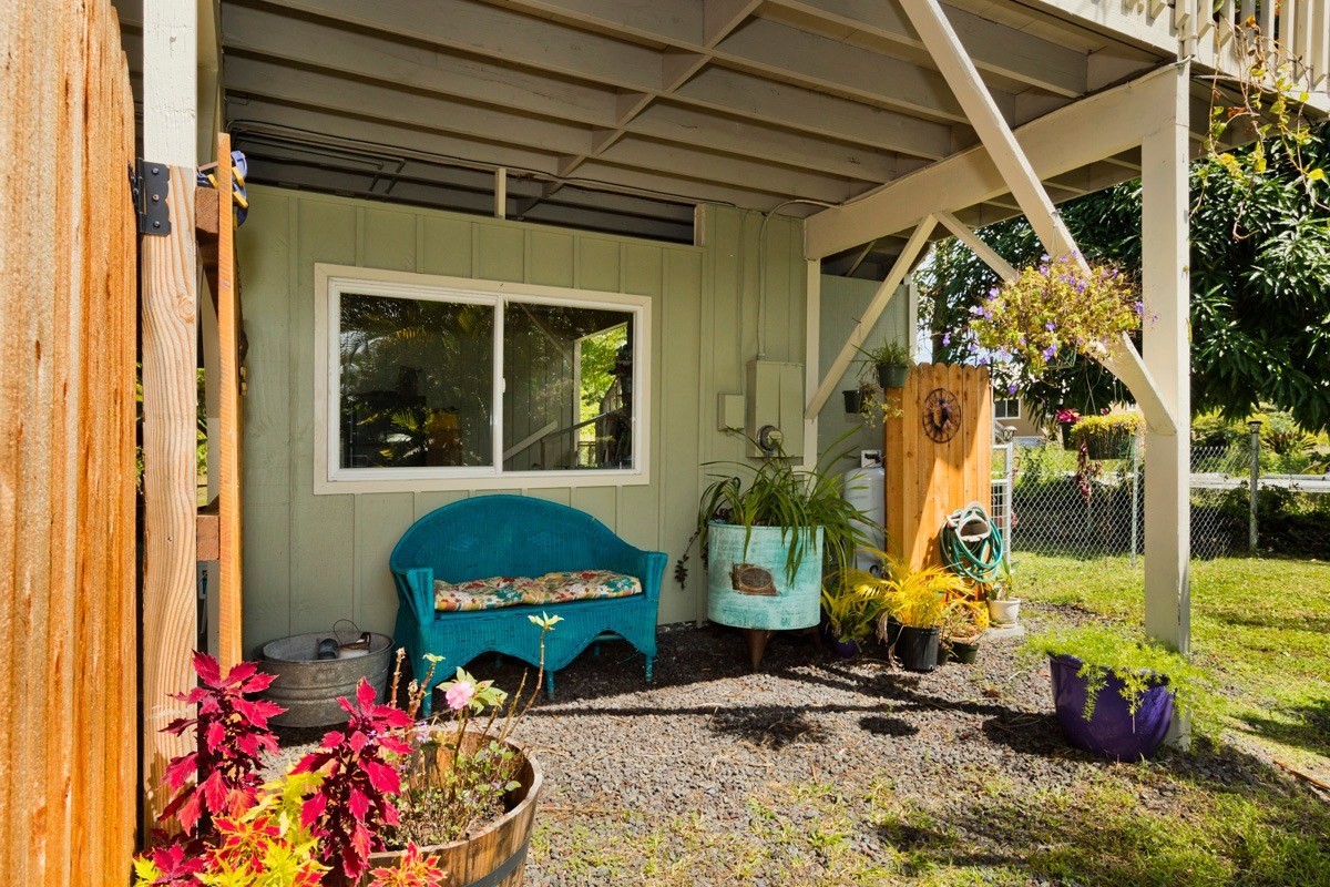 15-1565 Beach Road Keaau, HI 96749 - Photo 4 of 27 a front view of house with outdoor seating