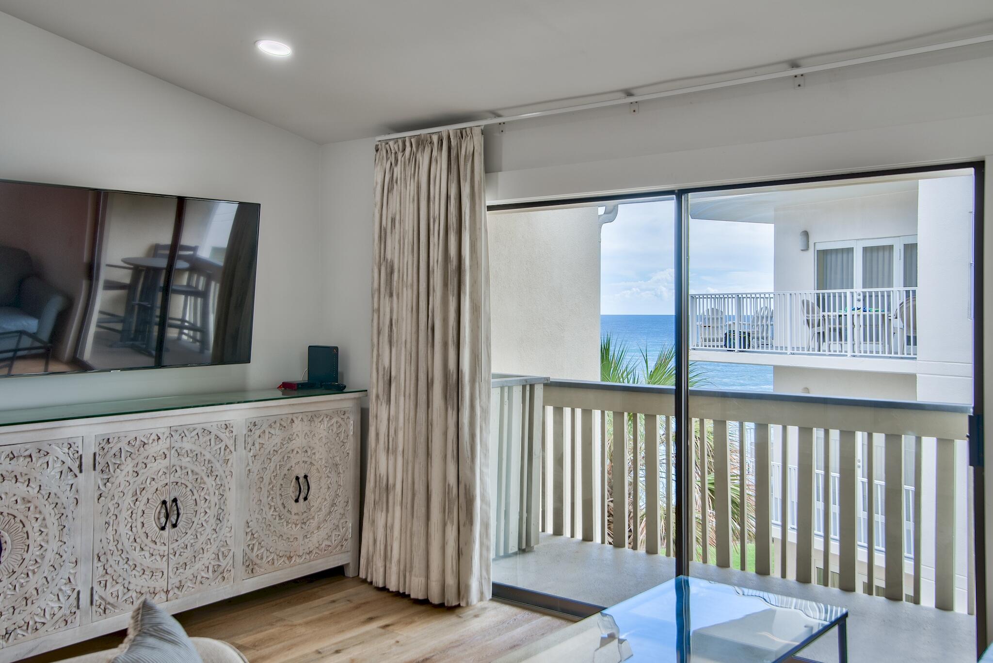 3692 East County Highway 30A, Unit 22 Santa Rosa Beach, FL 32459 - Photo 3 of 36 a view of an entryway with wooden floor and door