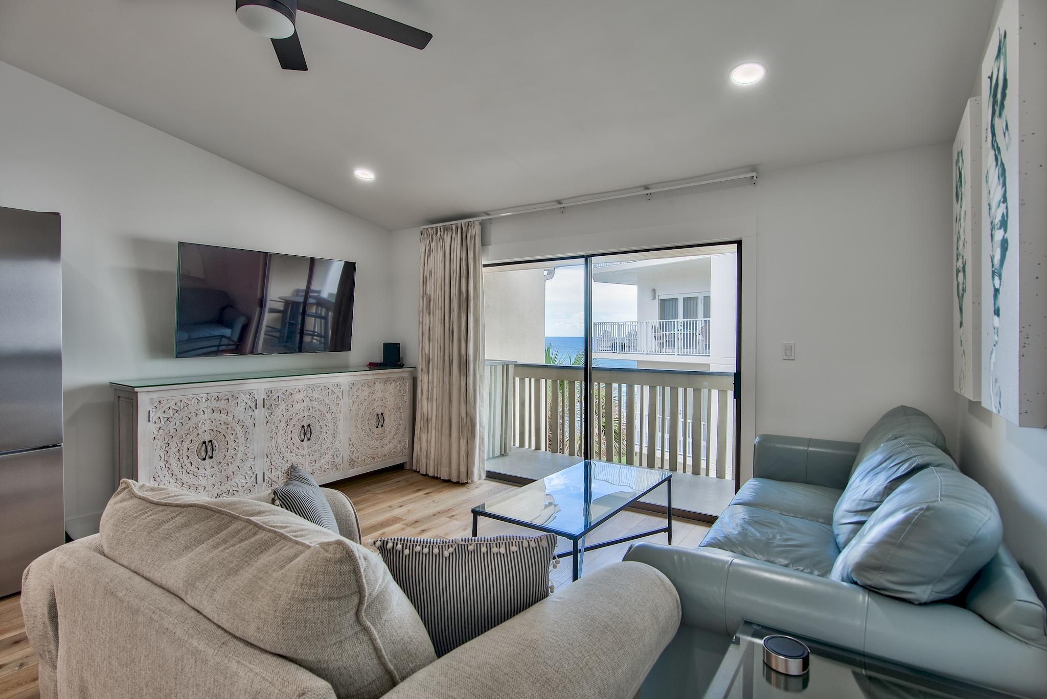3692 East County Highway 30A, Unit 22 Santa Rosa Beach, FL 32459 - Photo 4 of 36 a living room with furniture and a flat screen tv