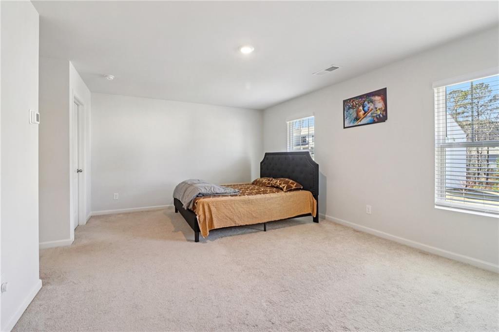 113 Deer Run Drive Dallas, GA 30132 - Photo 11 of 25 a bedroom with a bed and a window