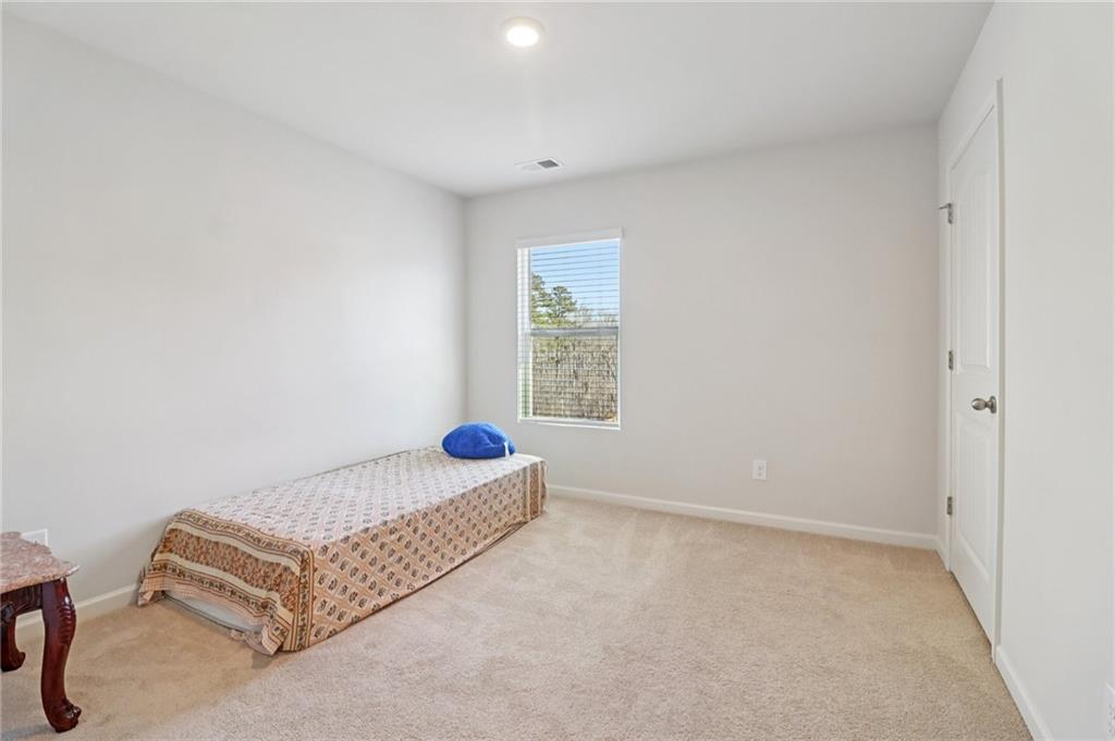 113 Deer Run Drive Dallas, GA 30132 - Photo 12 of 25 a room with a bed and a window