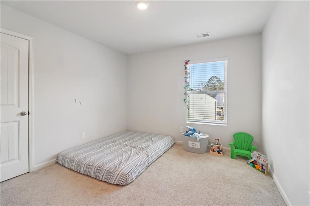 113 Deer Run Drive Dallas, GA 30132 - Photo 13 of 25 a bedroom with a bed and a window