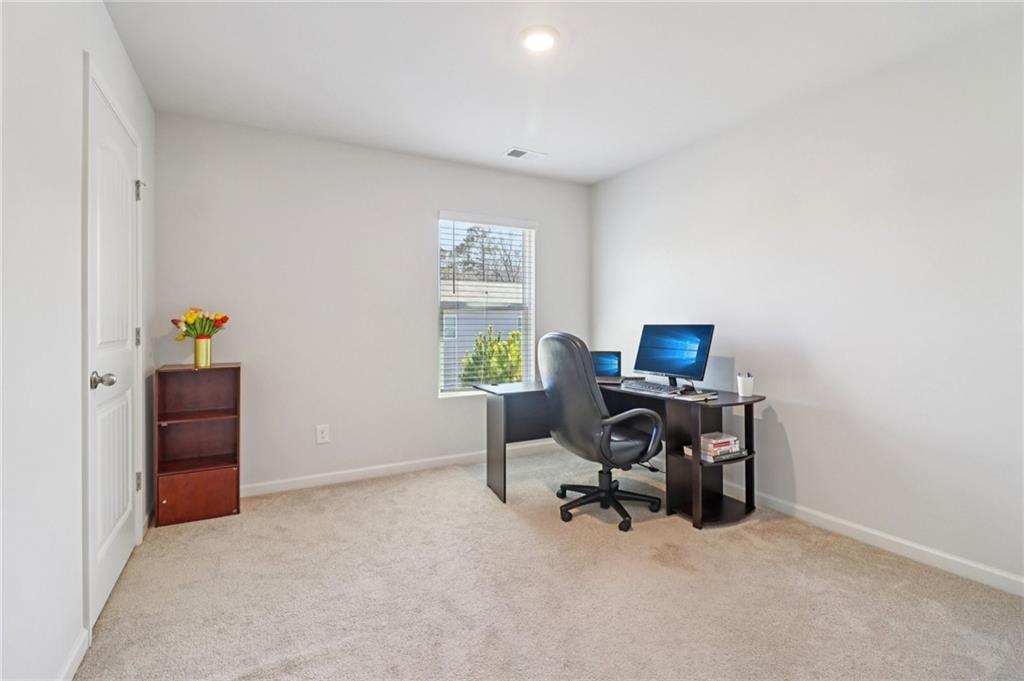 113 Deer Run Drive Dallas, GA 30132 - Photo 14 of 25 a view of a workspace with furniture and a window