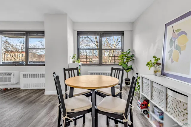 a view of a dining room with furniture and window