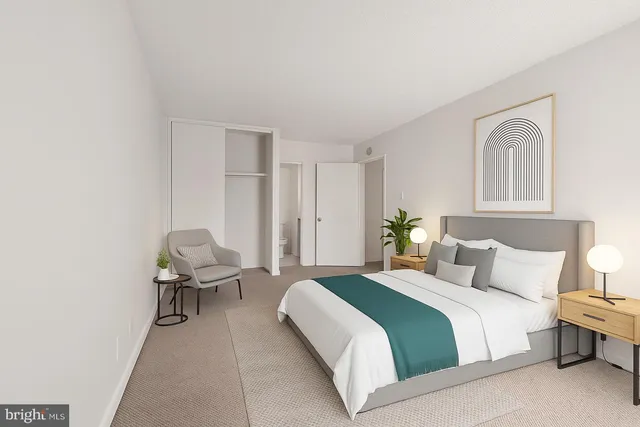 a bedroom with a bed and chair