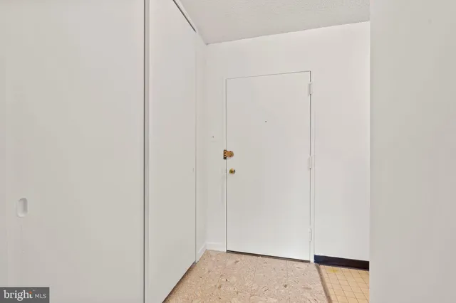 a view of a hallway with closet