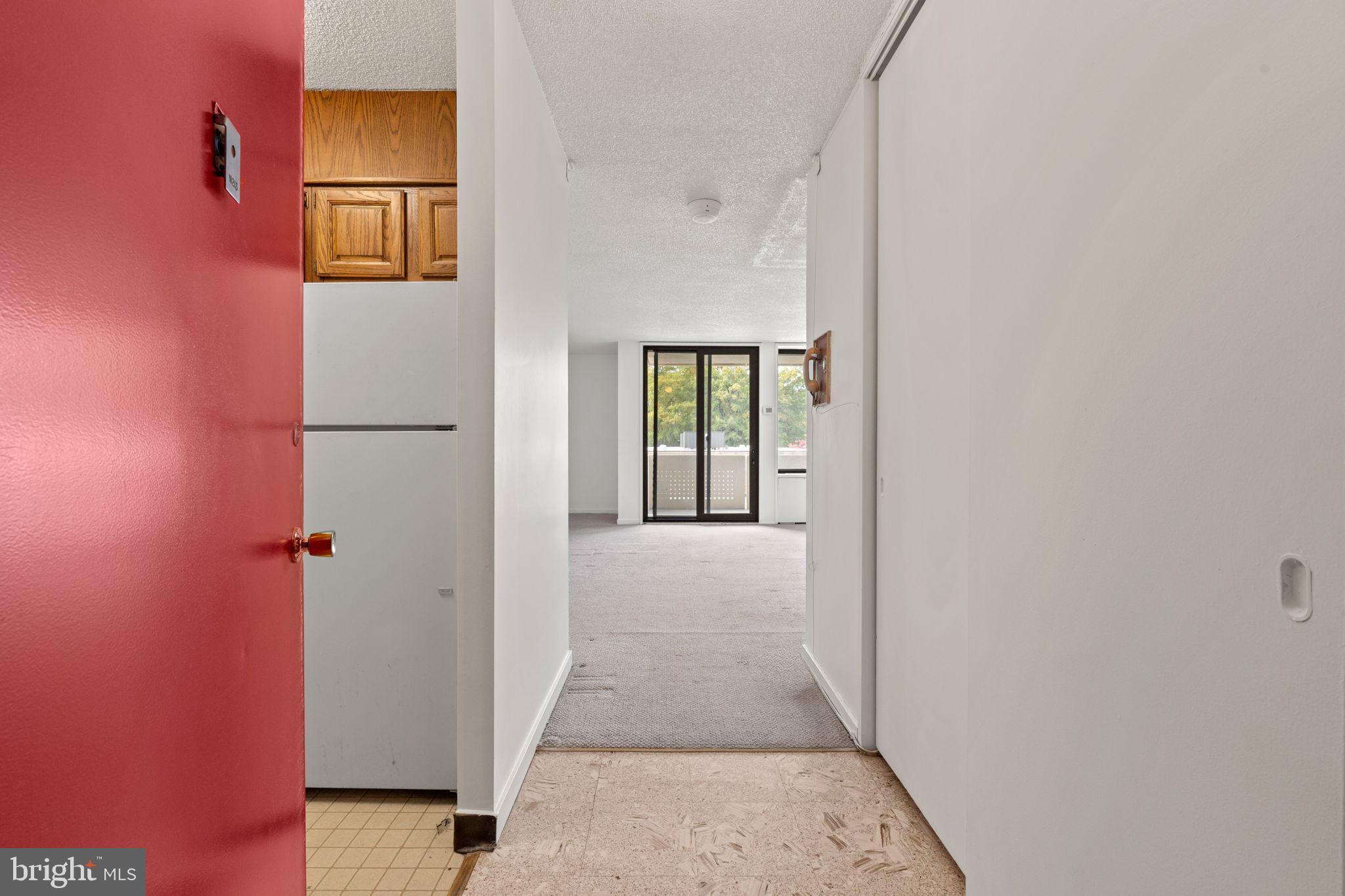 300 M Street Southwest, Unit N213 Washington, DC 20024 - Photo 5 of 14 wooden floor with a hallway