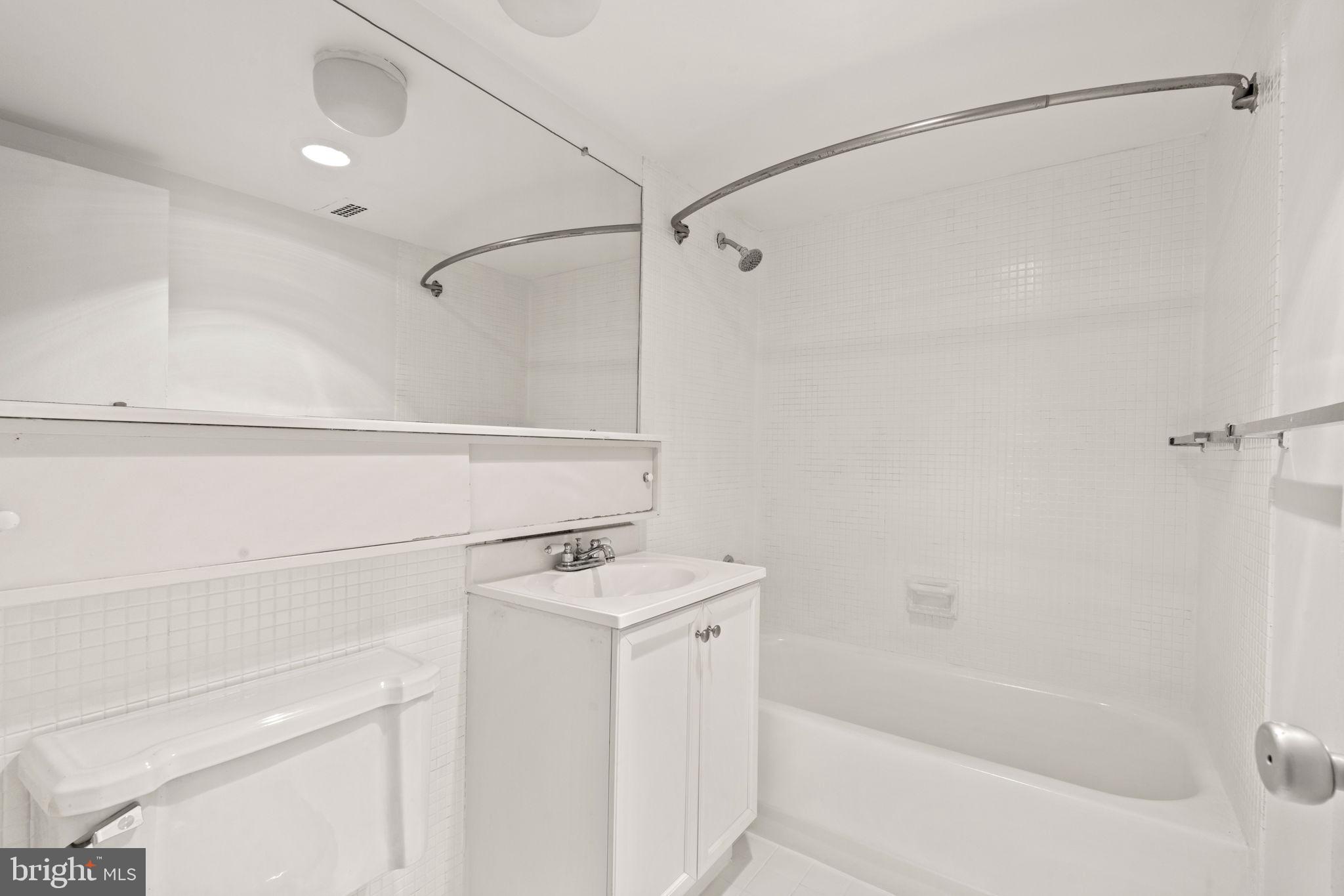 300 M Street Southwest, Unit N213 Washington, DC 20024 - Photo 10 of 14 a bathroom with a bathtub and a shower