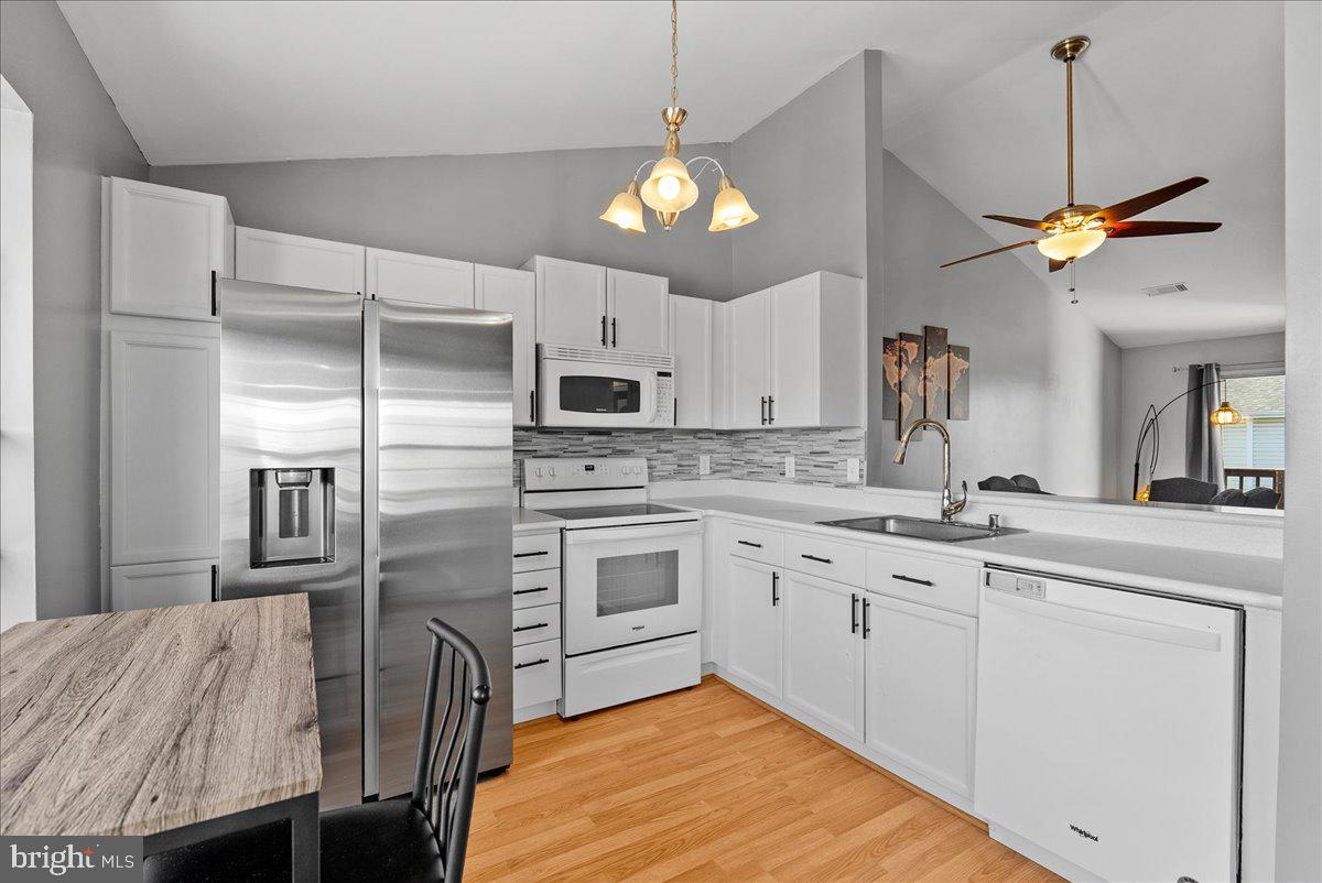7930 Minor Hill Road Manassas, VA 20109 - Photo 10 of 26 a kitchen with cabinets a center island and stainless steel appliances