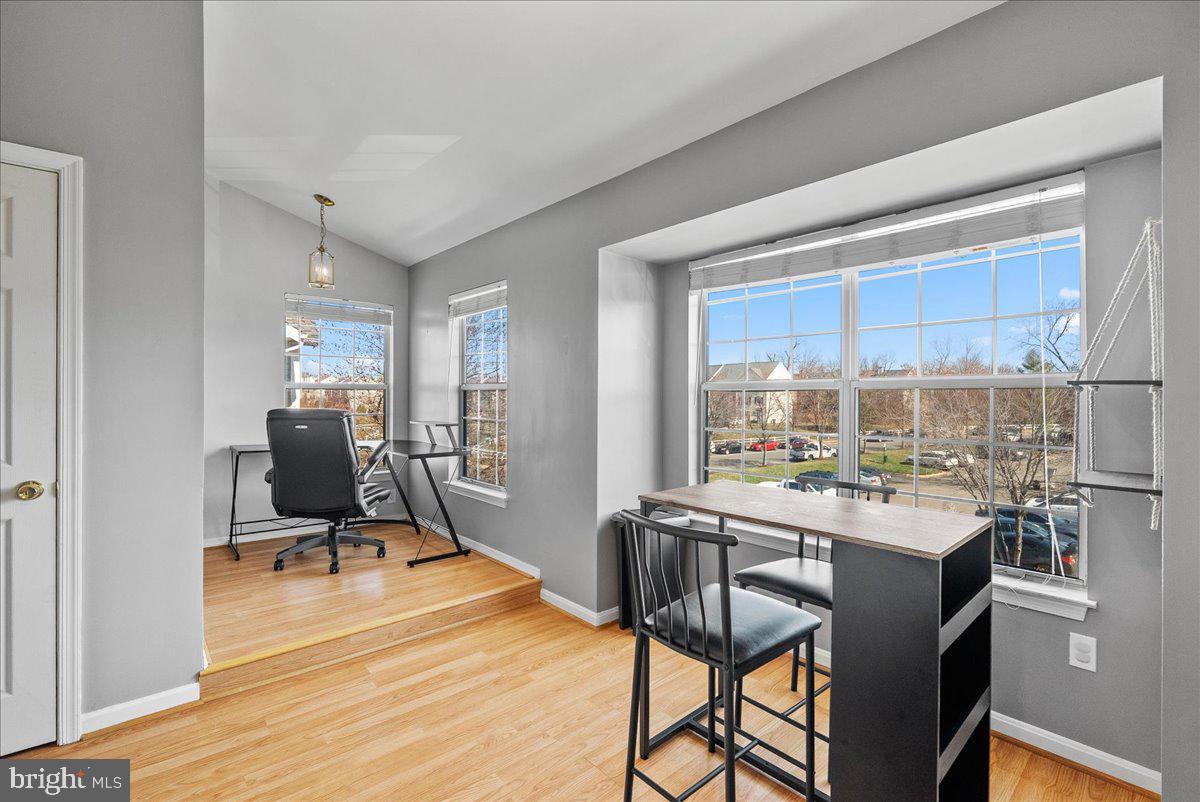 7930 Minor Hill Road Manassas, VA 20109 - Photo 11 of 26 a room with a table chairs and workspace