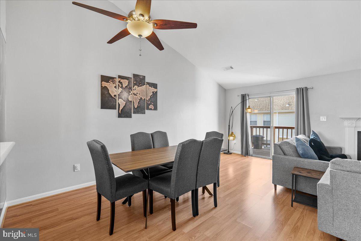 7930 Minor Hill Road Manassas, VA 20109 - Photo 7 of 26 a view of a dining room with furniture wooden floor and a chandelier