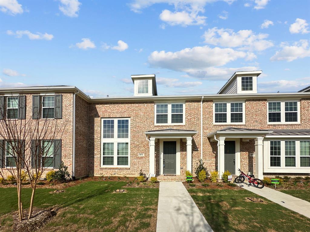 a front view of a house with a yard