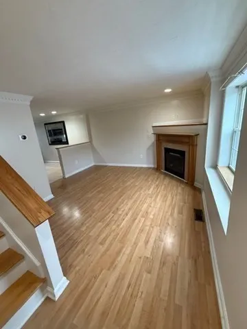 a bedroom with a bed and a fireplace