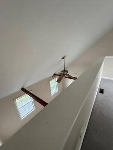 a view of an empty room with windows