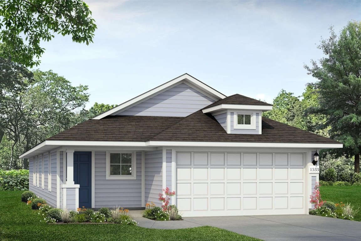 2817 Totley Road Manor, TX 78653 - Photo 1 of 1 a front view of a house with a garage