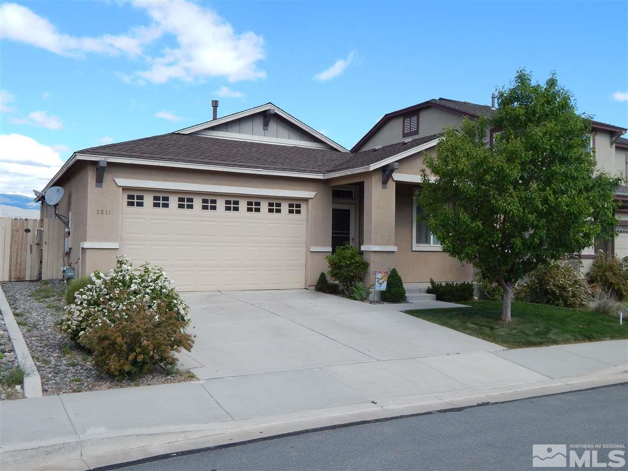 2231 Big Trail Circle Reno, NV 89521 - Photo 1 of 1 a front view of a house with a yard and garage