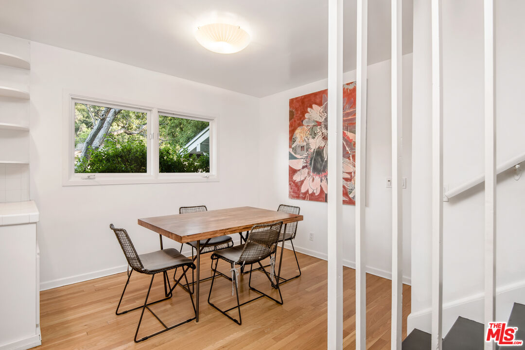 16849 Adlon Road Encino, CA 91436 - Photo 11 of 40 a view of a dining room with furniture and a window