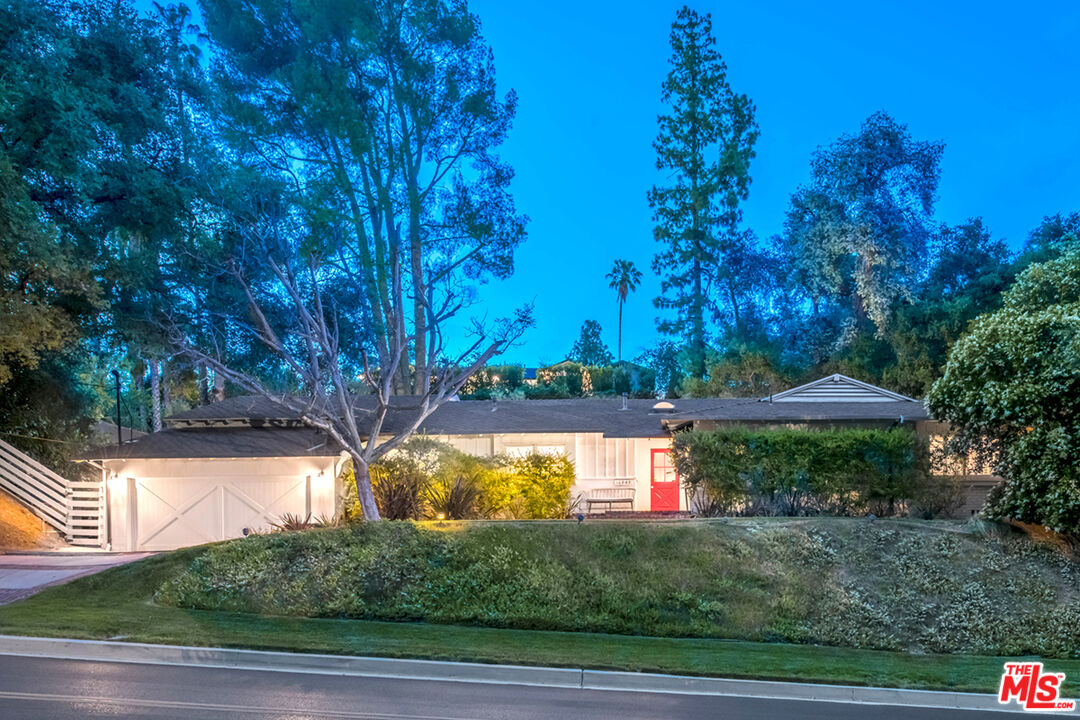 16849 Adlon Road Encino, CA 91436 - Photo 2 of 40 a view of a yard in front of the house with a yard