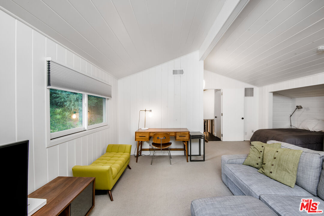 16849 Adlon Road Encino, CA 91436 - Photo 23 of 40 a bedroom with furniture and a window