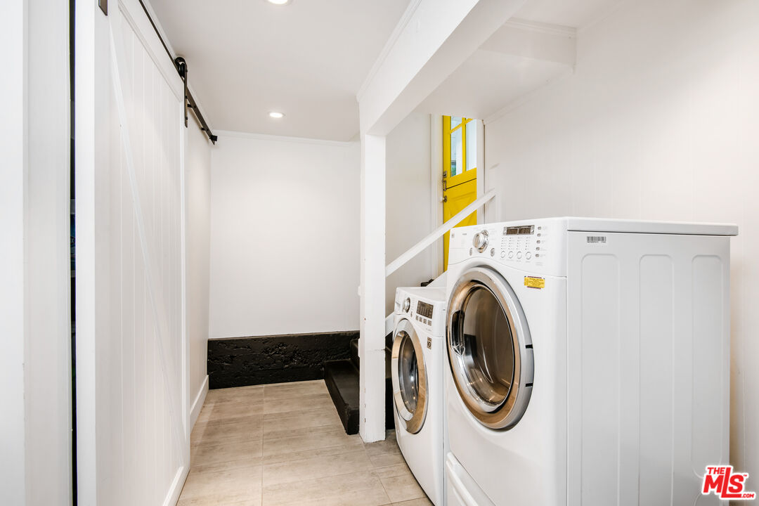 16849 Adlon Road Encino, CA 91436 - Photo 24 of 40 a utility room with dryer and washer