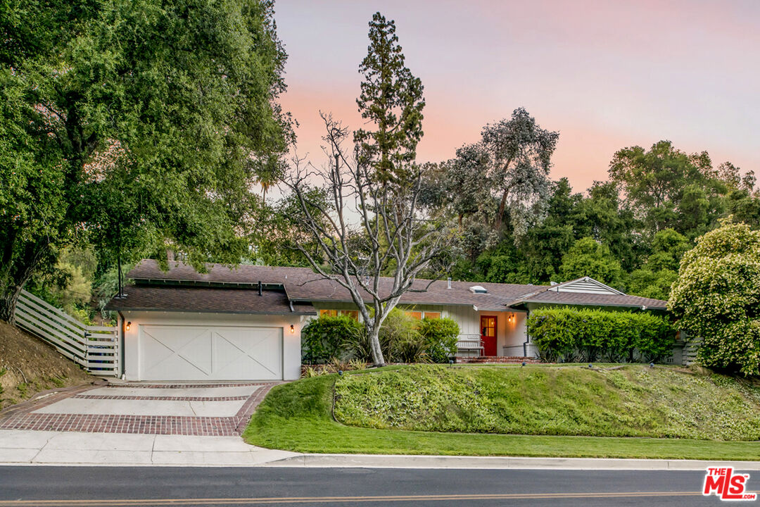 16849 Adlon Road Encino, CA 91436 - Photo 28 of 40 a front view of a house with a yard