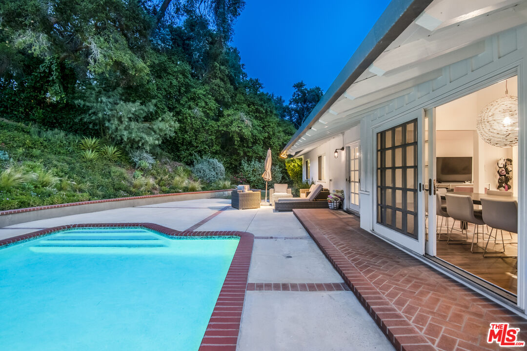 16849 Adlon Road Encino, CA 91436 - Photo 3 of 40 a view of a house with backyard and sitting area