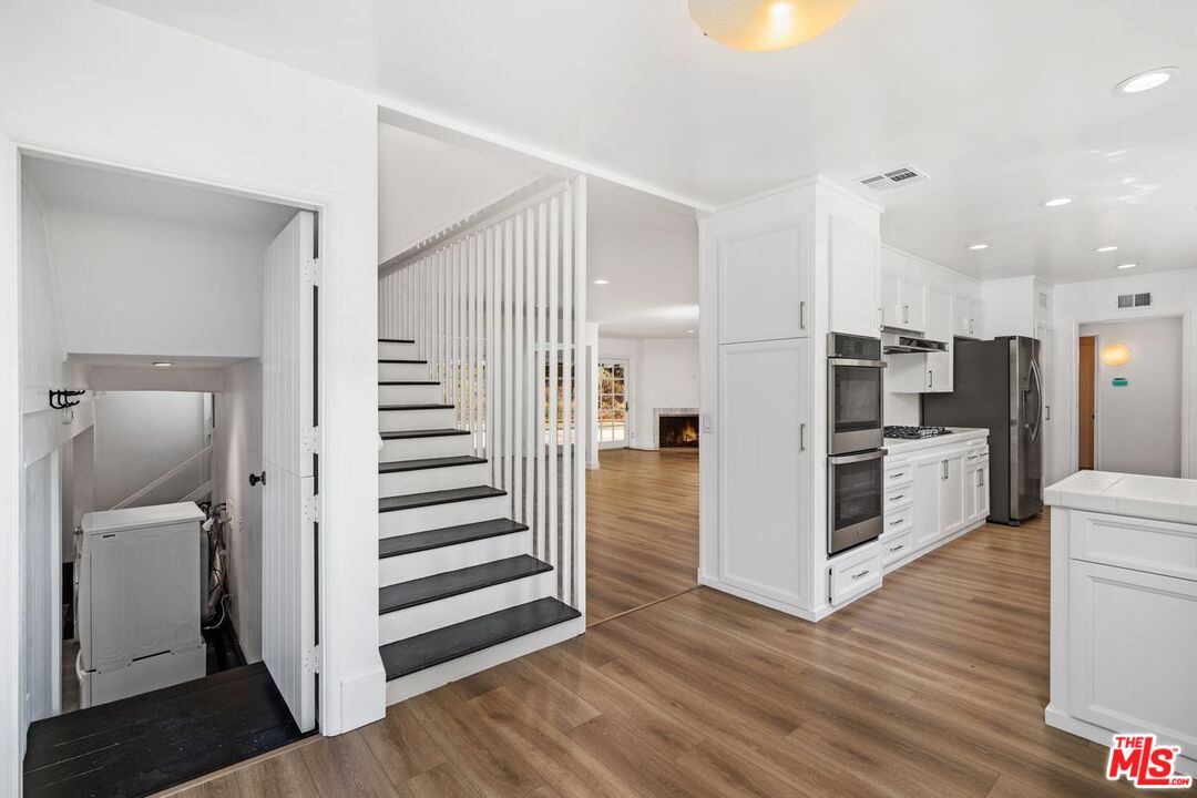 16849 Adlon Road Encino, CA 91436 - Photo 37 of 40 a view of kitchen with wooden floor and electronic appliances