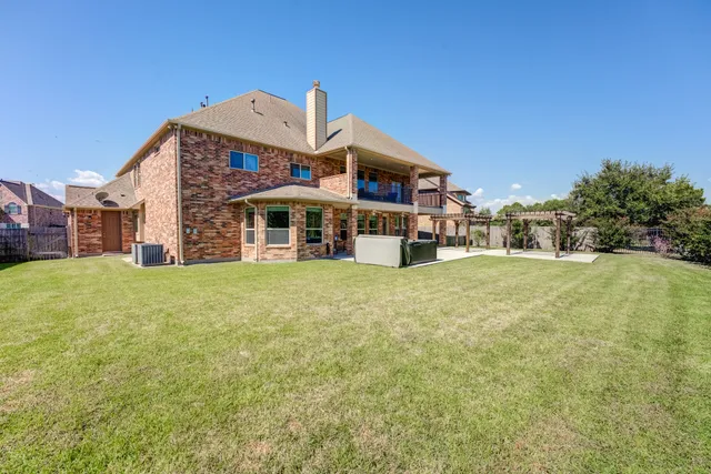 a front view of a building with garden