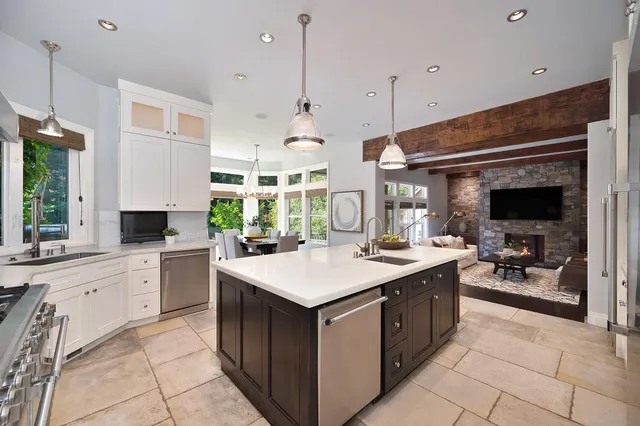 a living room with fireplace furniture and a flat screen tv