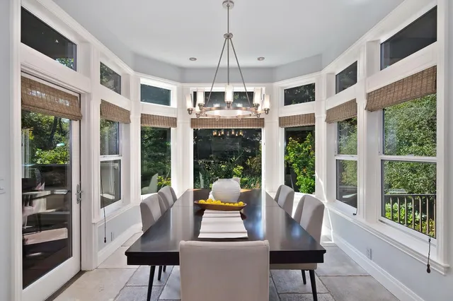 a view of a room with furniture and wooden floor
