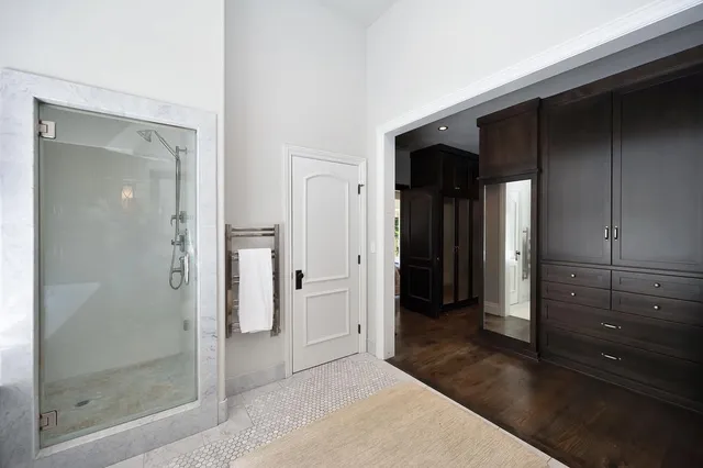a bathroom with a double vanity sink and mirror